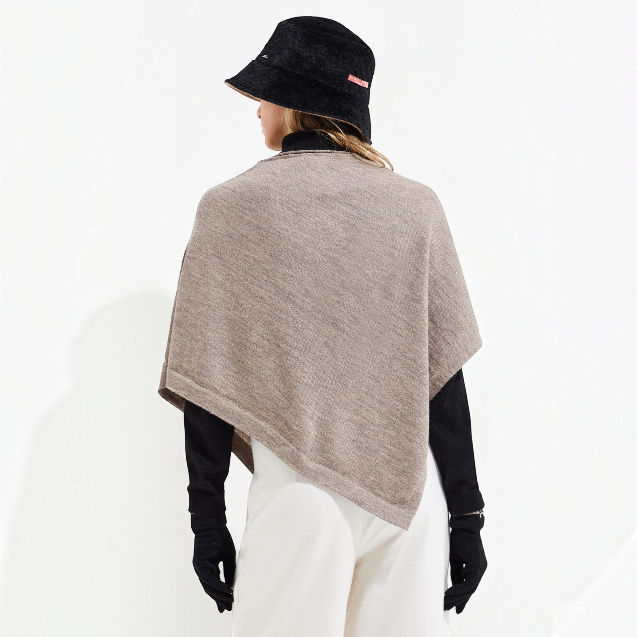 Back view of the Yura Baby Alpaca and silk poncho showing its elegant asymmetrical drape