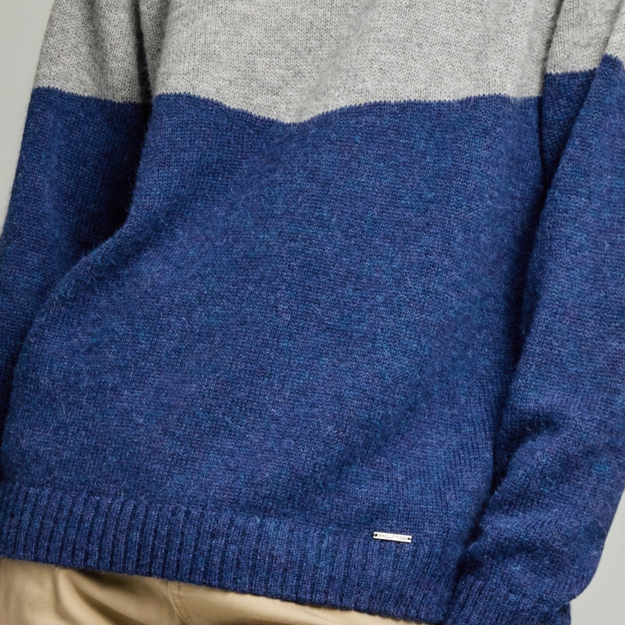 Close up of Yanick men’s alpaca sweater with raglan sleeves and ribbed neckline