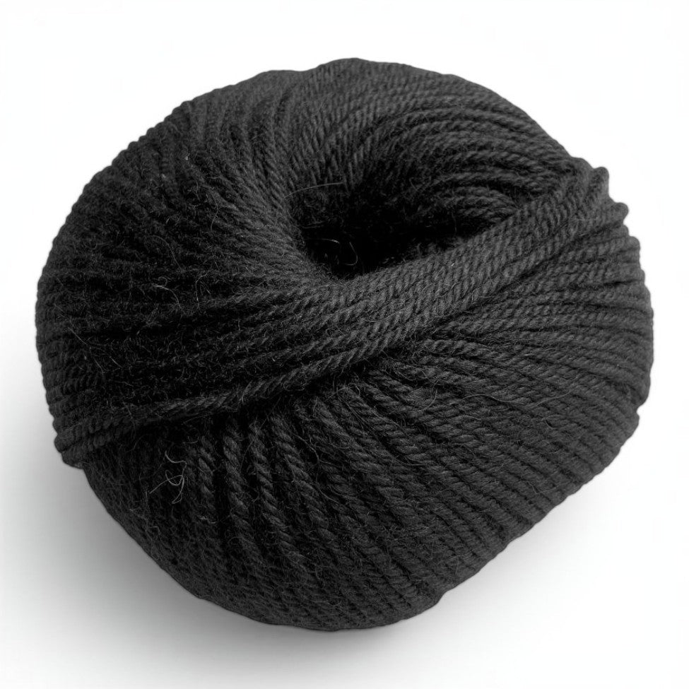 Ball of 100% baby alpaca sport weight yarn in classic black.