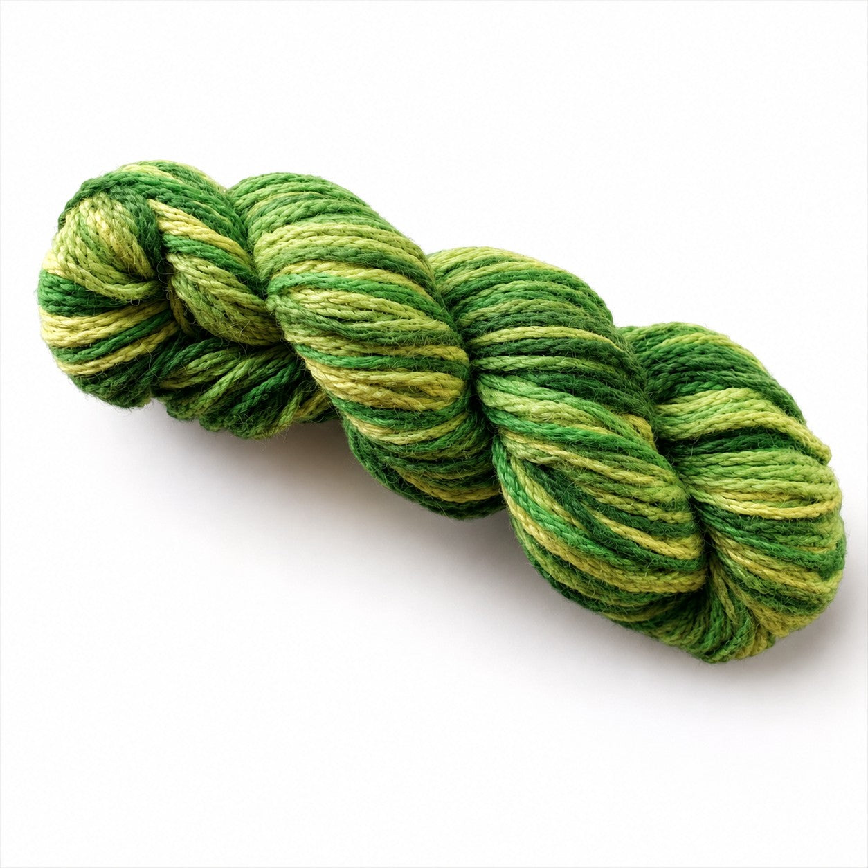Twisted hank of Allure hand-painted alpaca and merino yarn in lime, leafy and forest green tones.